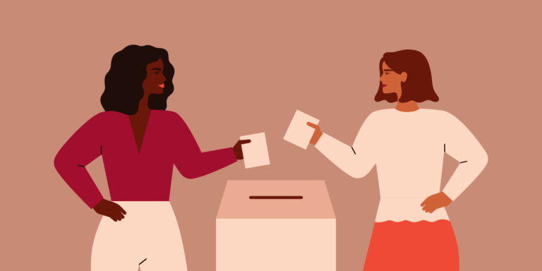 Two Strong girls are putting paper ballot in box